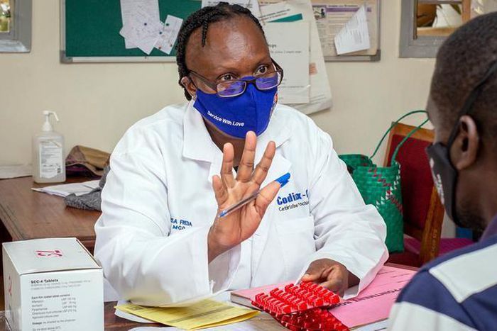 A doctor attends to a patient