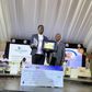 Ssentogo posing with his award. Besides him is the Iganga District Resident Judge, Justice David Batema