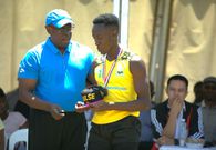 Rukare awards MVP Tyaba Erdin Hatim with a medal
