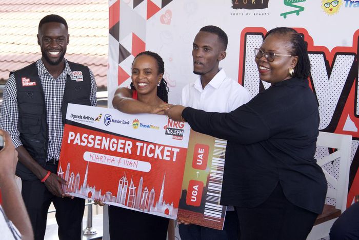 Nahurira Ivan and his guardian Kamugisha Martha congratulated by Christine Mawadri, the NRG Director of Partnerships