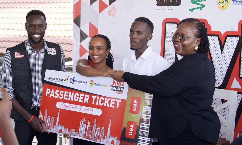 Nahurira Ivan and his guardian Kamugisha Martha congratulated by Christine Mawadri, the NRG Director of Partnerships