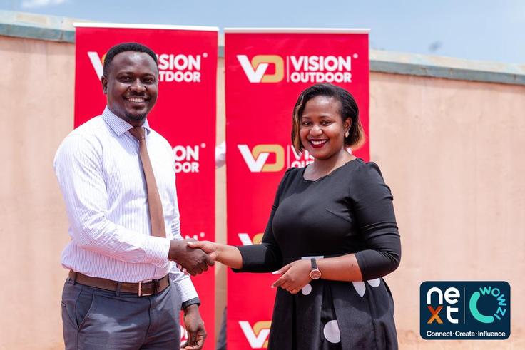 Next Media’s Chief Marketing Officer, Danze Edwin and Vision Group’s Head of Marketing and Communication, Lorraine Tukahirwa shake hands