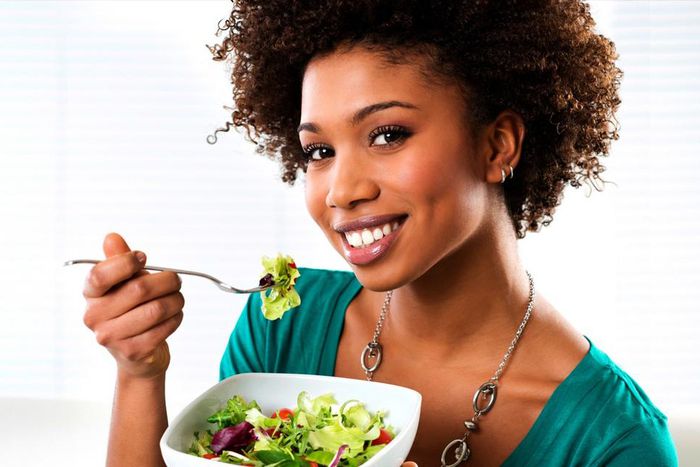 Woman eating vegetables(ebony)