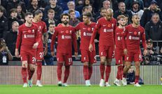 Liverpool players celebrate a goal against Spurs in the Premier League