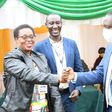 The ICOB president Uganda chapter, Grace Mugabirwe Mutebile (left) with State Minister for Trade Industry and Cooperatives David Bahati (Right) at the convention in Kabale Town.