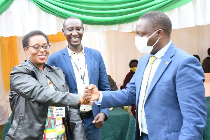 The ICOB president Uganda chapter, Grace Mugabirwe Mutebile (left) with State Minister for Trade Industry and Cooperatives David Bahati (Right) at the convention in Kabale Town.