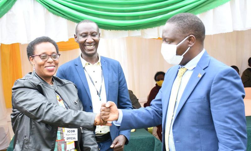 The ICOB president Uganda chapter, Grace Mugabirwe Mutebile (left) with State Minister for Trade Industry and Cooperatives David Bahati (Right) at the convention in Kabale Town.