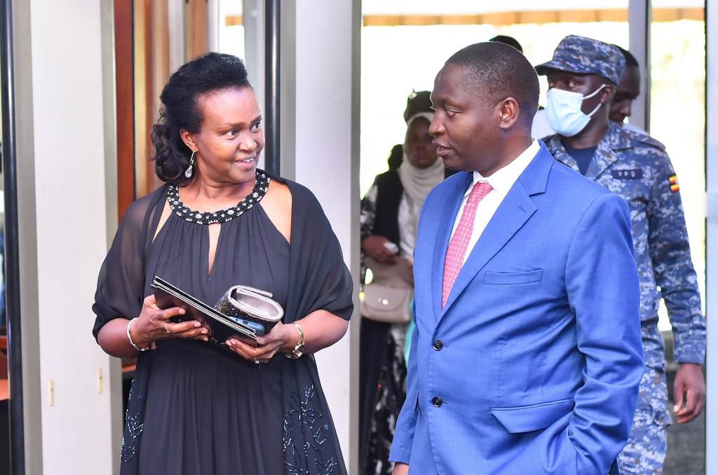 Minister Bahati interacts with Mrs Jane Baine