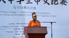 Hilda Ayebare, assistant curriculum specialist for foreign languages at the Uganda National Curriculum Development Center (NCDC), speaks during the "Chinese Bridge" language proficiency competition in Kampala, Uganda, June 2, 2024.
