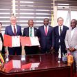 The Vice Chancellor Prof. Barnabas Nawangwe (Centre) and UWO President Dr. Alan Shepard (3rd Left) show off the signed MoU as Left to Right: UWO's Dr. Opiyo Oloya and Dr. Lily Cho as well as University Secretary Yusuf Kiranda, UWO's Dr. John Yoo and He...