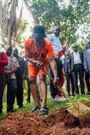 Awilo planting a tree