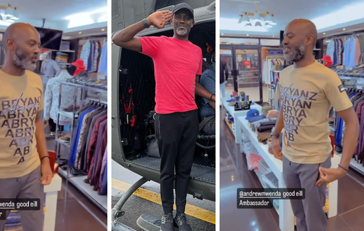 Andrew Mwenda tries on Abryanz apparel while 'bazukulu' make fun of him/Instagram