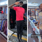 Andrew Mwenda tries on Abryanz apparel while 'bazukulu' make fun of him/Instagram