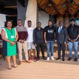 Next Media Group CEO Kin Kariisa(center) with the audio producers and songwriters