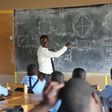 A head tecaher at Mbazzi primary School carrying out a class session