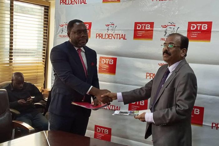 DTB CEO Varghese Thambi and Tetteh Ayitevie, the CEO of Prudential Uganda at the signing of the MoU