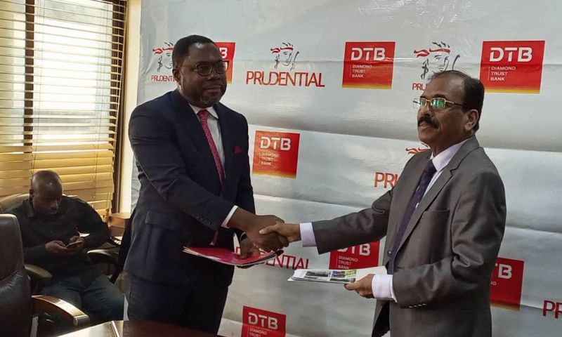 DTB CEO Varghese Thambi and Tetteh Ayitevie, the CEO of Prudential Uganda at the signing of the MoU