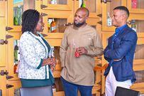 Josephine Okui Ossiya (L) chats with the outgoing and incoming BAU leaders