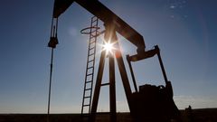 FILE PHOTO: The sun is seen behind a crude oil pump jack in the Permian Basin in Loving County, Texas, U.S., November 22, 2019. REUTERS/Angus Mordant