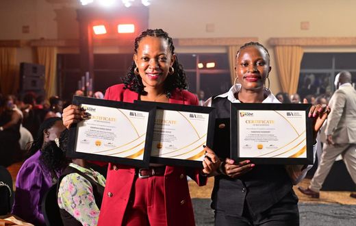 Jubilee's Diana Ssempasa Ndege (L) and  Nabatanzi Rosemary display their certificates