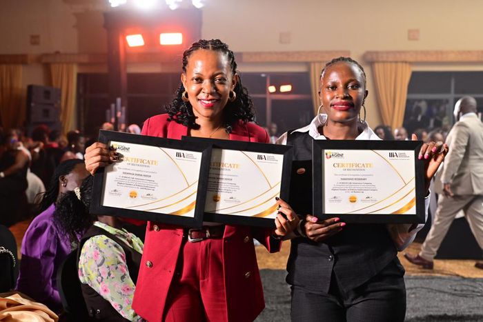Jubilee's Diana Ssempasa Ndege (L) and  Nabatanzi Rosemary display their certificates