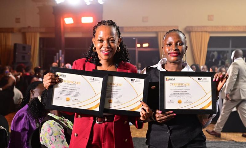 Jubilee's Diana Ssempasa Ndege (L) and  Nabatanzi Rosemary display their certificates