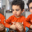 Adorable baby boy reviewing chef's cooking