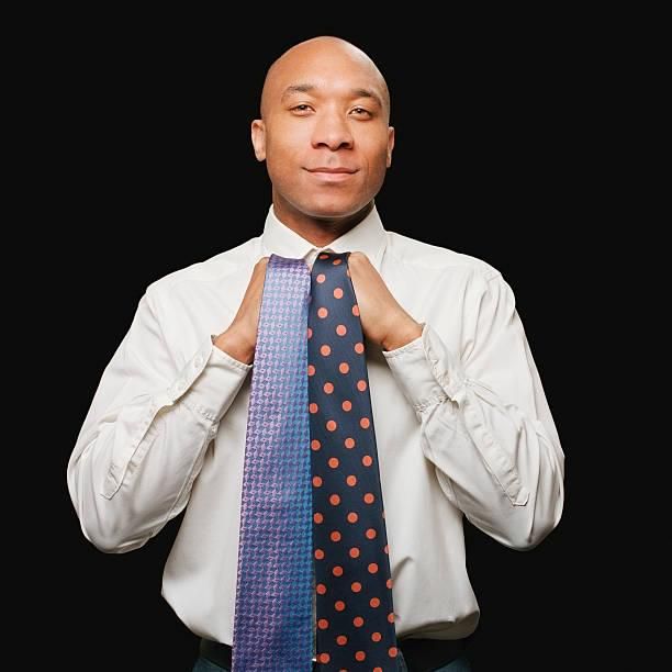A man showing neckties