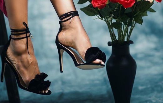Woman in strappy high heels [Image credit: Godisable Jacob]