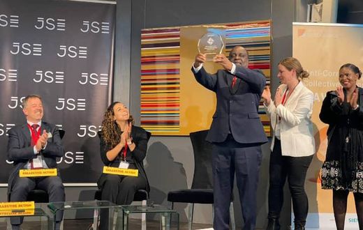 Receiving the award on behalf of Uganda