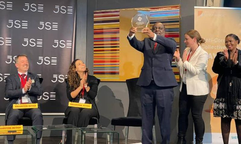 Receiving the award on behalf of Uganda