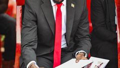 Bobi Wine signing the eulogies book