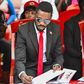 Bobi Wine signing the eulogies book