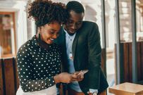 A couple viewing something on phone/Courtesy
