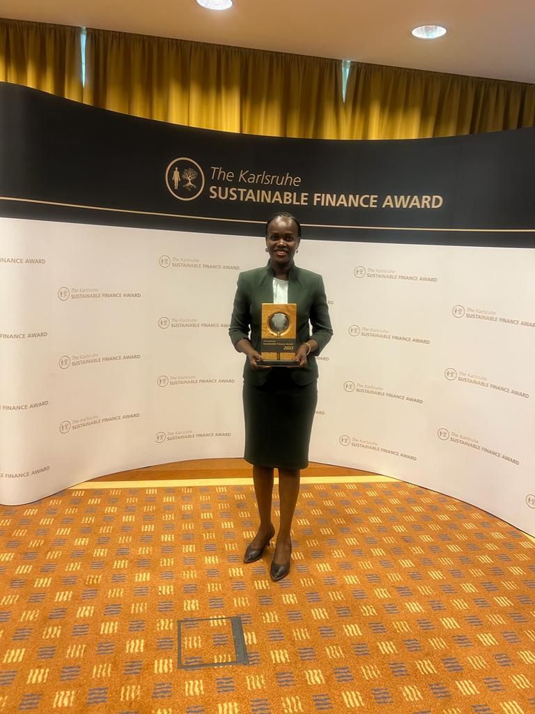 UDB Managing Director, Patricia Ojangole, holding the accolade she won for the Sustainability Leader of the Year 2023 at the prestigious Annual Karlsruhe Sustainable Finance Awards in Germany. She has been named the winner for the third time running