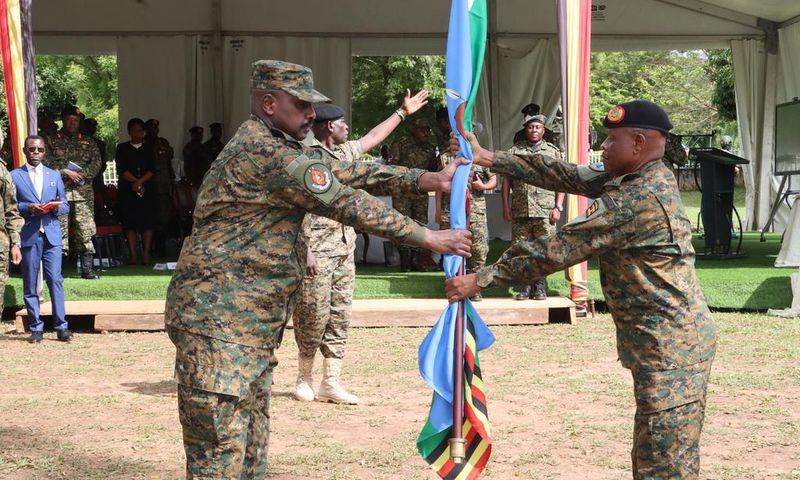 Gen Muhoozi Kainerugaba received instruments of office from the outgoing CDF Gen Mbasu Mbadi