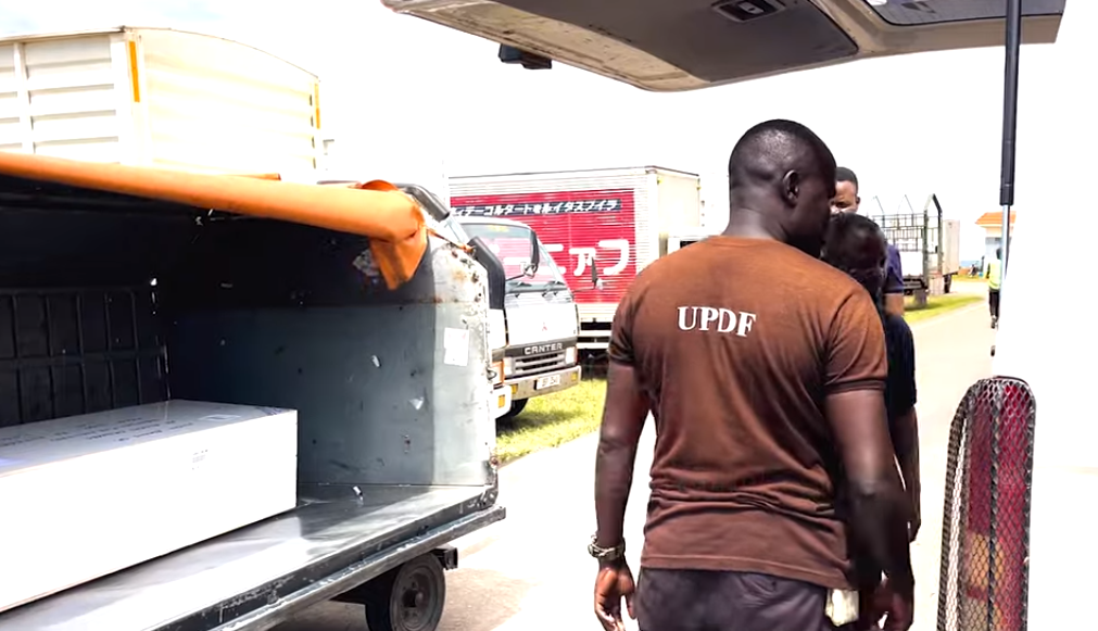Gloria's body on arrival at Entebbe International Airport