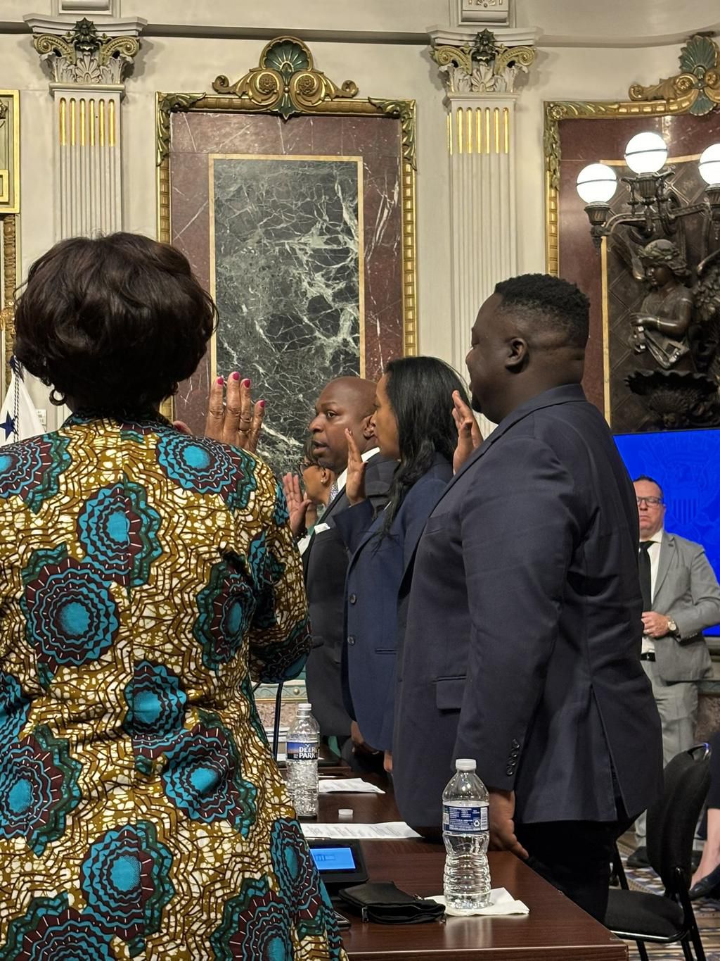 Sserunjogi taking his oath along with other council members