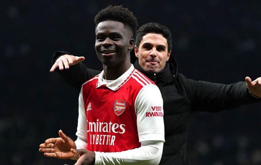 Arsenal manager Mikel Arteta celebrates with goalscorer, Bukayo Saka