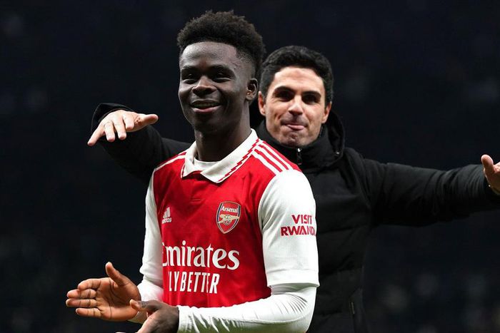 Arsenal manager Mikel Arteta celebrates with goalscorer, Bukayo Saka