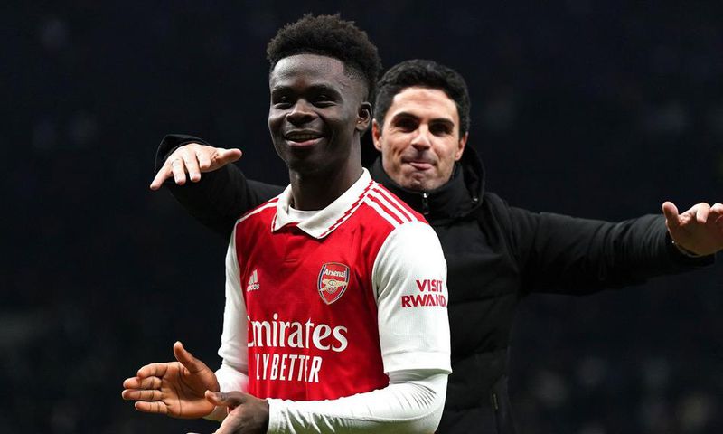 Arsenal manager Mikel Arteta celebrates with goalscorer, Bukayo Saka