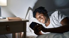 Black man in bed [Shutterstock]
