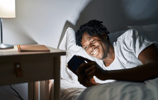 Black man in bed [Shutterstock]