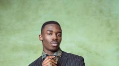 A man well-dressed for a photo