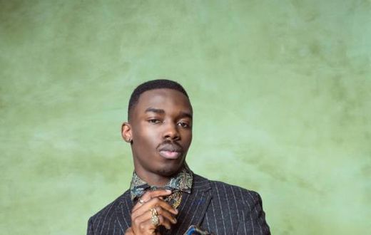 A man well-dressed for a photo