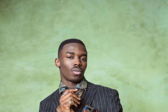 A man well-dressed for a photo