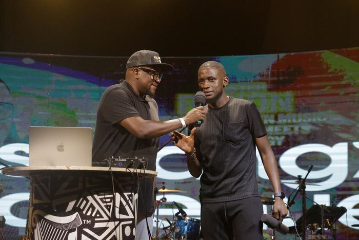 Digital content creator and comedian, Uncle Mo on stage with Swangz Avenue's Benon Mugumbya