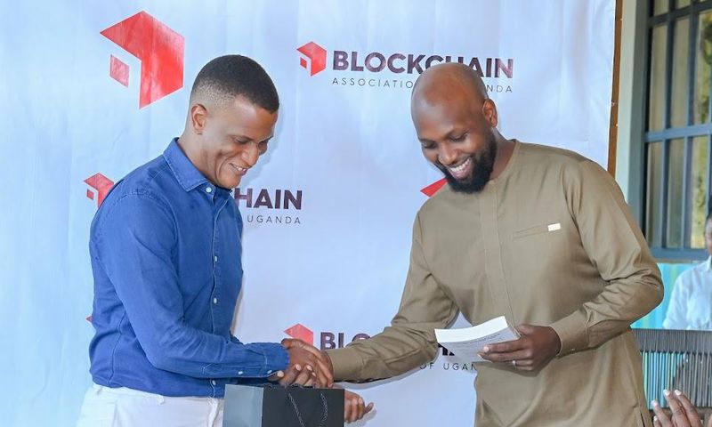 Mr Reginald Tumusiime (L) took over from Kwame Rugunda