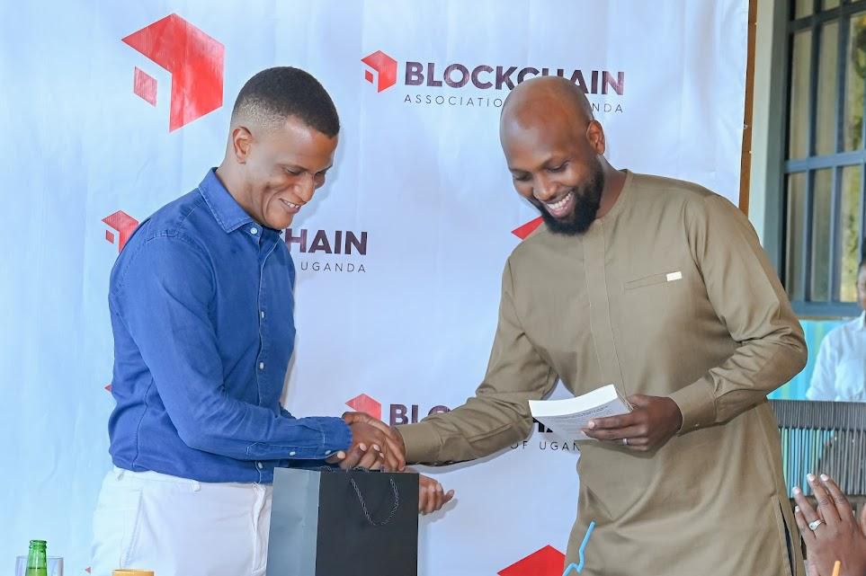 Mr Reginald Tumusiime (L) took over from Kwame Rugunda
