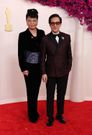 Ke Huy Quan and his wife Echo wore suits on the red carpet.